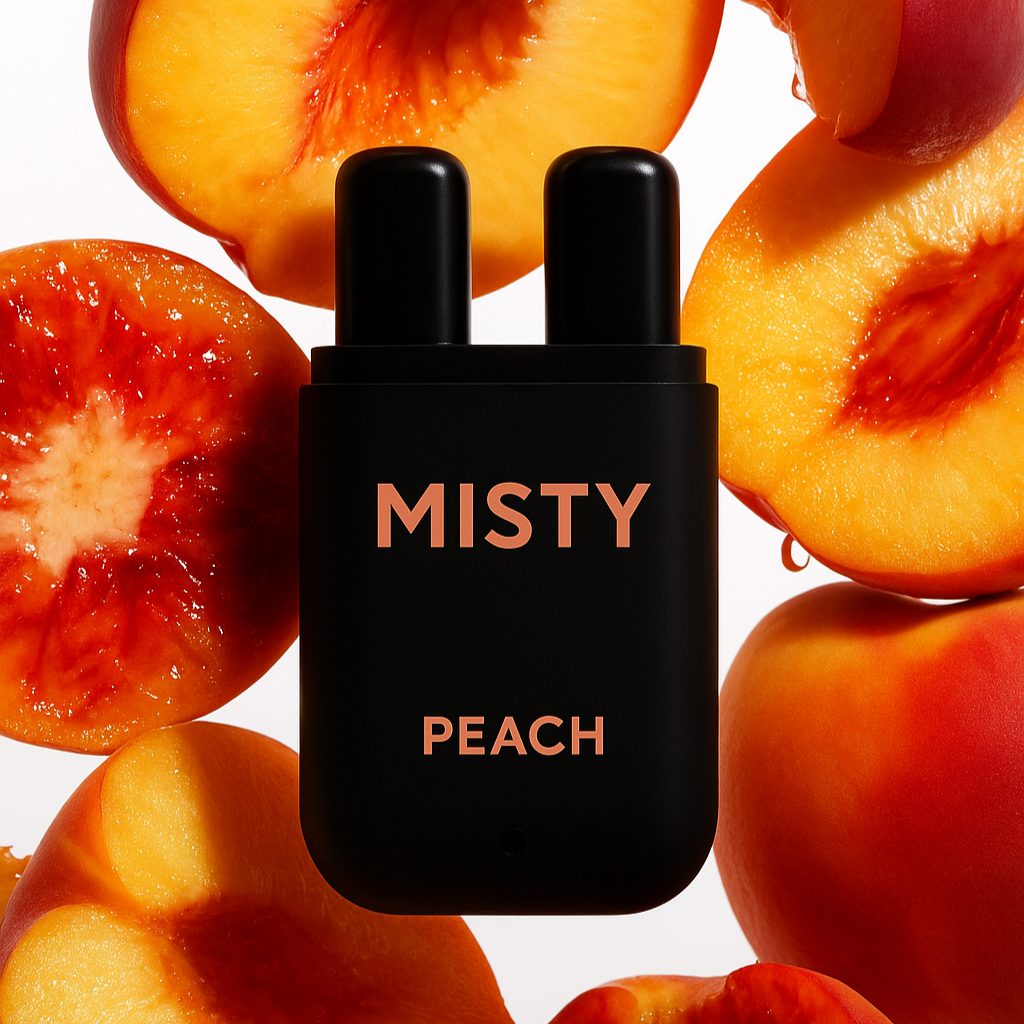 Black bottle labeled 'Misty Peach' surrounded by sliced peaches on a white background